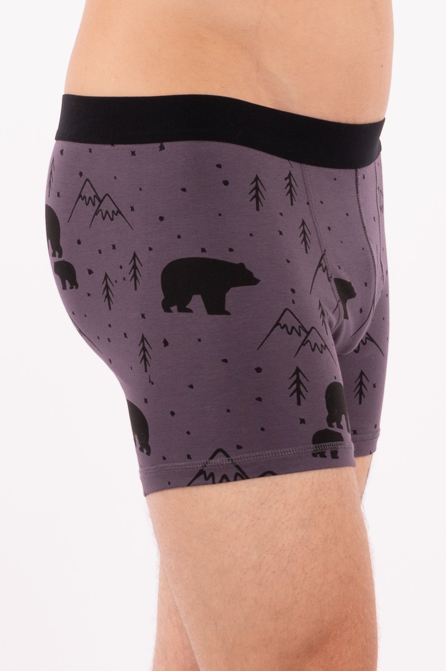 This image displays a pair of men's boxer briefs, labeled as the "65_WABU_Boxer Greystone Bear". The boxers are presented in a dark grey color, adorned with a playful pattern featuring bears and mountains.