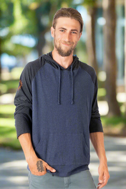 Man wearing a navy blue hoodie with black sleeves on a white background